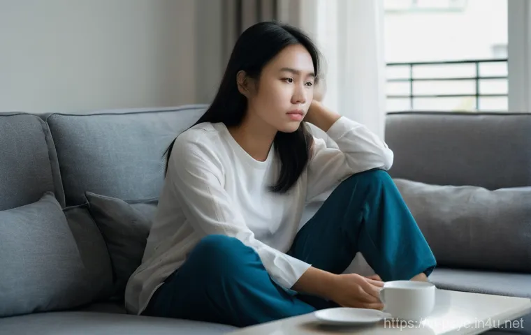 불안장애와 공황장애의 차이점 - **Persistent Anxiety:**
    "A young Vietnamese woman, in her mid-20s, sits alone on a comfortable s...